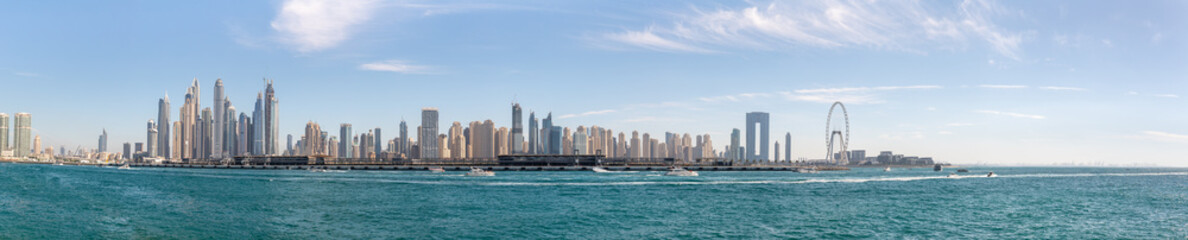 View from the window of the tourist bus to the architecture on Palm Jumeirah island in Dubai city, United Arab Emirates