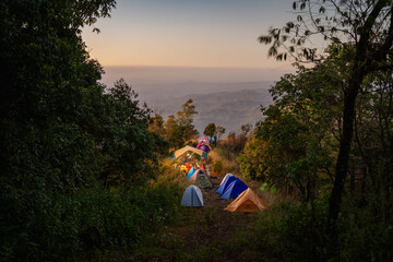 family camping in the mountains and sunset (Changmai province, Thailand)