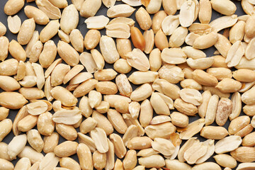 Whole shelled peanut nuts kernels close-up studio background