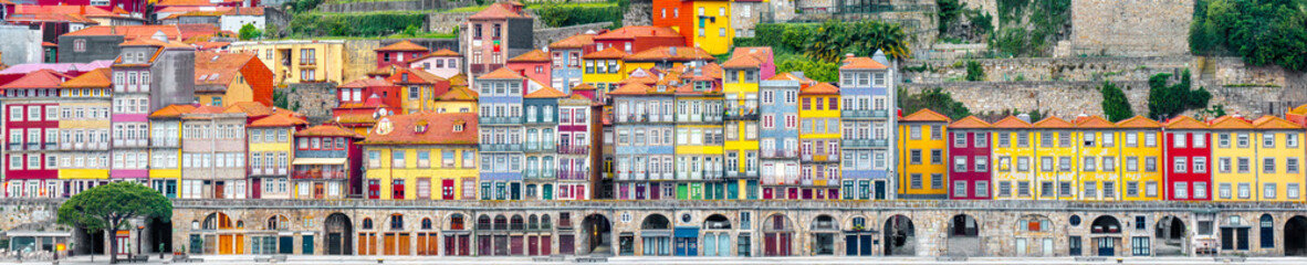 Panorama of colorful medieval buildings in Oporto  - Ribeira neighborhood in Porto, Portugal - obrazy, fototapety, plakaty