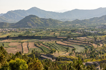 Beautiful landscape view of an agricultural fields in the mountain valley