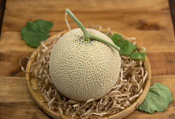 Premuim Crown Musk Melon on wooden background, Shizuoka Crown Melon Yama Grade on wooden background.
