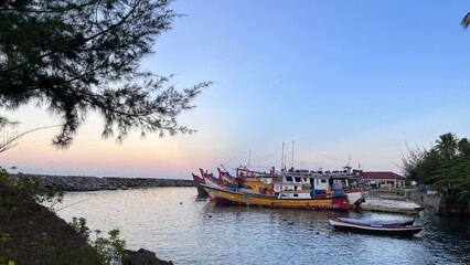 Fishing boats docked at the harbor waiting for departure at Samadua, South Aceh Indonesia 
