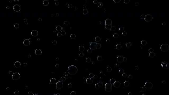 Slow rise of bubbles on a dark background.