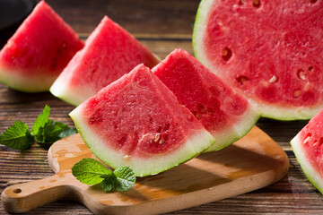 Fresh sliced watermelon on wooden background