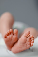 Newborn feets closeup, natural colours