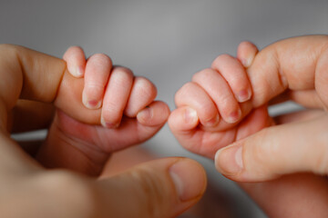 Newborn hands closeup, natural colours