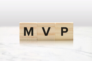MVP on Wooden Blocks - Most Valuable Person or Player Sports and Business Concept