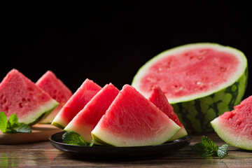 Fresh sliced watermelon on wooden background