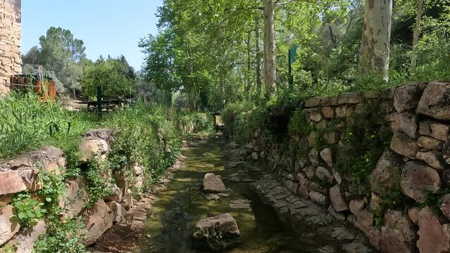 Water flows in a small and ancient stream of clean water in the Ein Hamad nature reserve, at the entrance to Jerusalem 