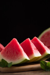 Fresh sliced watermelon on wooden background