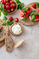 sandwich of homemade bread, cream cheese, strawberries and basil