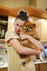 Teenage girl with a small dog