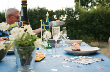 traditional Swedish food on a table outdoors celebrating midsummer