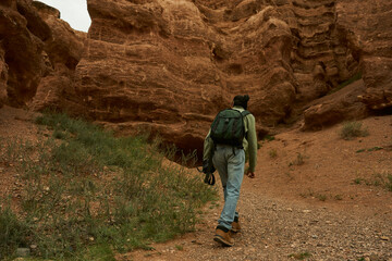 tourist walks through the canyon