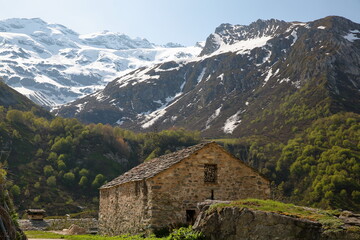 Fototapeta na wymiar A chapel surrounded by mountains, located next to Roc de la Peche hut along the Chaviere valley, Pralognan la Vanoise,Vanoise National Park, Northern French Alps, Tarentaise, Savoie, France