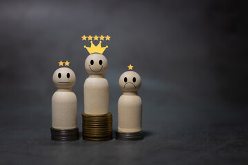 Numerous coins are stacked in a graph with wooden figurines. Up and down arrow of businessman...