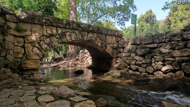 Water flows in a small and ancient stream of clean water in the Ein Hamad nature reserve, at the entrance to Jerusalem - Israel.