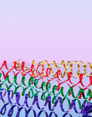 A lot of multicolored serpentine. Red, yellow, green, purple colors. Space for text.