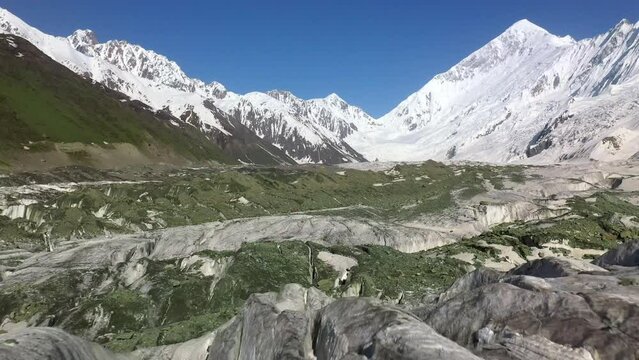 Drone footage, Rakaposhi Pakistan. Wide angle of snow-covered mountain range. Also known as Dumani is a mountain of the Karakoram range, located in the Nagar valley, of the Gilgit-Baltistan territory.