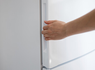 emale hand opening refrigerator