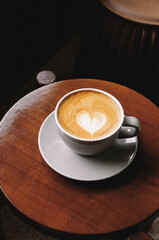 cup of coffee on wooden table