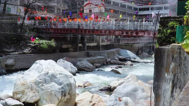 water stream flowing through rock with hot spring vapour at day video is taken at manikaran manali himachal pradesh india on Mar 22 2023.