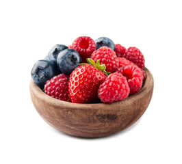 Sweet raspberry, strawberry and blueberry in wooden bowl