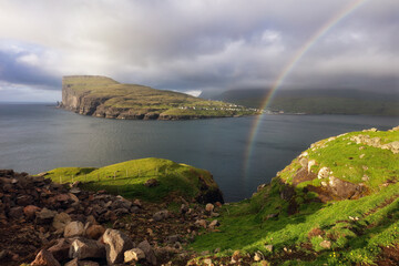 Faroe Islands landscape with rainbow, view of Risin and Kellingin, the giant and the witch view...