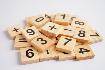 Number wood block cubes for learning Mathematic, education math concept.