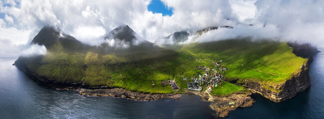 Faroe islands - Aerial panoramic view of the village of gjogv on cliffs washed by the ocean, Eysturoy island,  Denmark, Europe © TTstudio