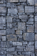 grey stone wall texture covered in wire mesh
