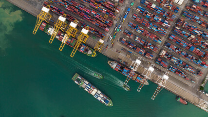 cargo ship and truck at seaport waiting for container dock by crane shipment harbor loading...