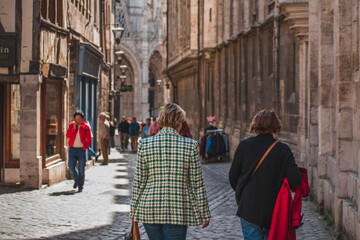 Two women walking the streets of Rouen in France