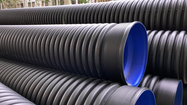 Close-up of large plastic corrugated pipes for water supply systems.