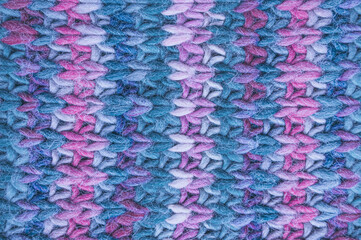 Fototapeta na wymiar Handmade knitted background with detail wool threads.