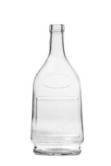 An empty bottle of an unusual shape made of transparent glass for cognac, whiskey on a white background.