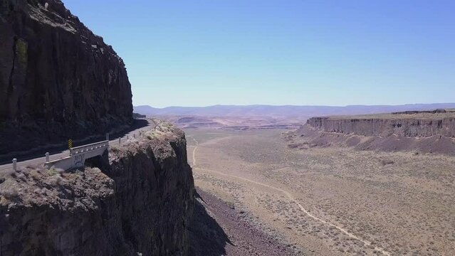 Cliff aerial: Road carved into rock wall of Frenchman Coulee, WA state