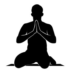 Silhouette of a muslim man sitting on her knees praying. Front view