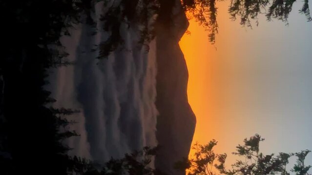 Multi-colored dawn in the mountains with clouds and trees. Hike to the top of Hoverla. We welcome morning