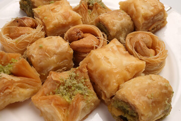 Layered stuffed pastry Baklava middle eastern sweet dessert on white background