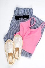 Set of seasonal summer fashion woman clothes, top view. Women's summer outfit.
