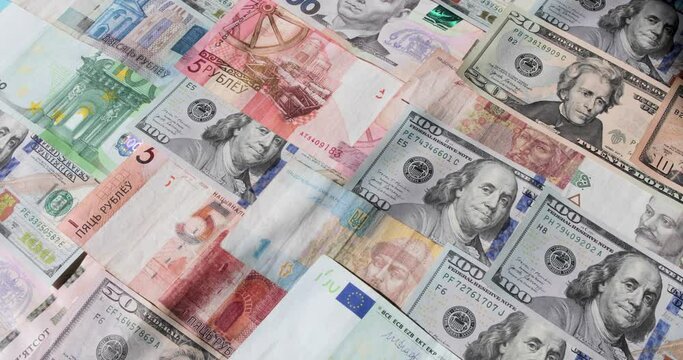 Money dollars hryvnia euros rotate rubles of various denominations 
rotate