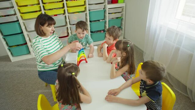 The top view shows the task to the children as an activity. Tasks for preparing for school, motor skills of hands. High quality 4k footage