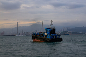 Large fishing boats docked by the sea in Hong Kong