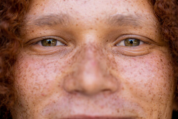 Portrait of happy biracial man looking at camera and smiling