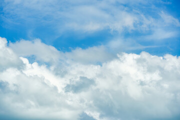 Naklejka na ściany i meble White fluffy cloud and blue sky in sunny day