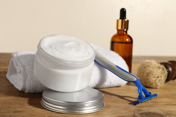 Set of men's shaving tools on wooden table