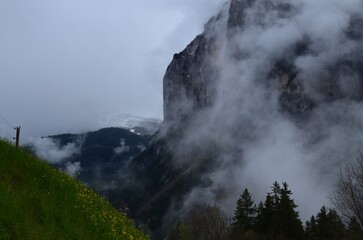 Picturesque view of mountains covered with fog