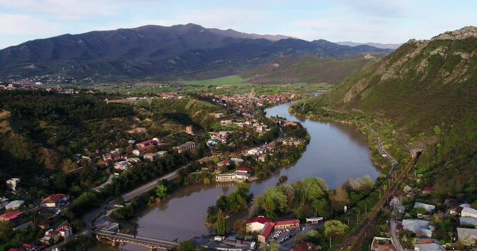 Aerial view on old capitol city of Georgia, Mtskheta. Beautiful Old city. Aerial view shot on Dji inspire 2. Cinematic drone footage. Sunset or Sunrise